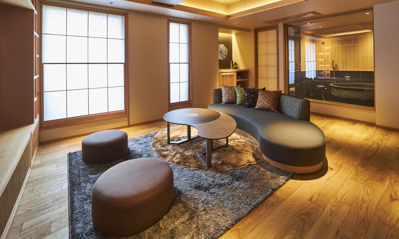 SAKE Bar Hotel ASAKUSA — 台東区駒形 · 障子と無垢床で構成した蔵スイートの居間、奥に内風呂